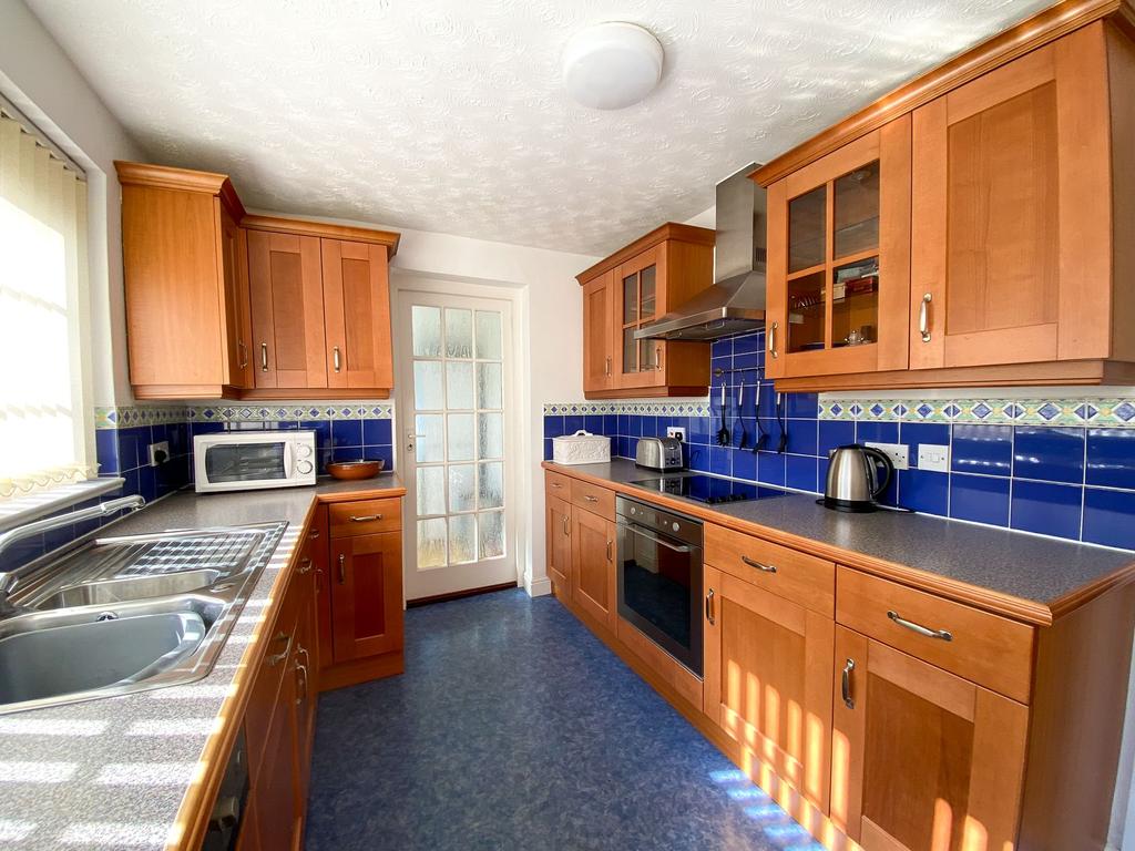 Kitchen leading into Utility Area