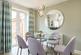 The dining area leads out through double doors to the garden