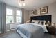 The spacious bedroom offers the perfect space to relax