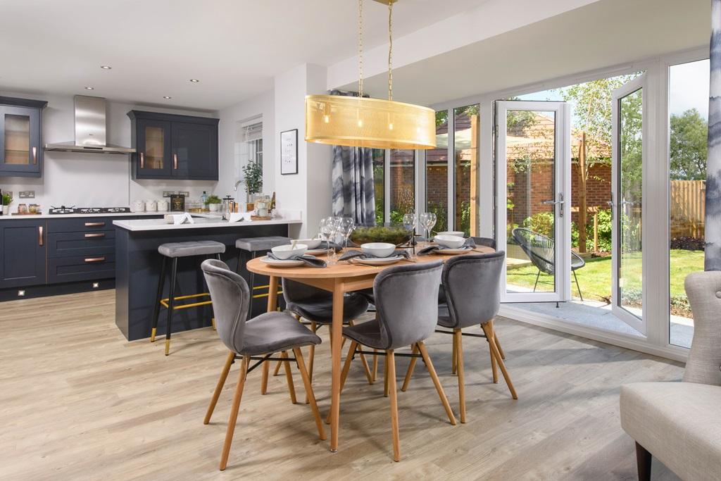 Open plan kitchen with dining area and glazed bay leading on to garden