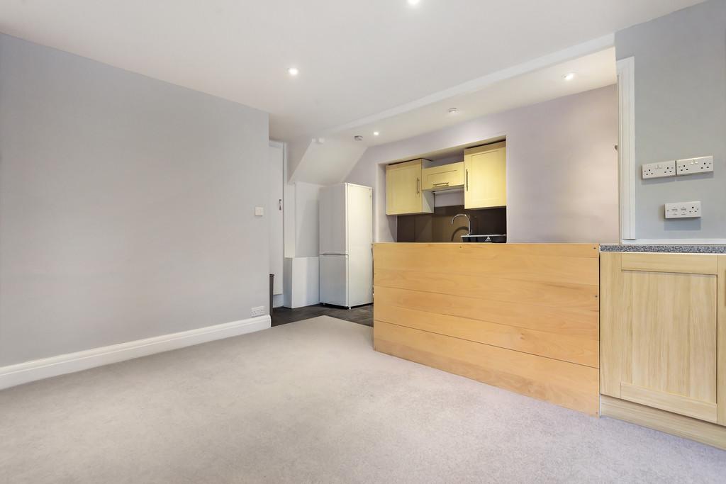 Sitting room with open plan kitchen