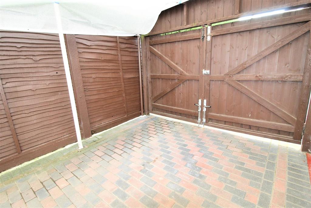 Block paved drive double gates carport