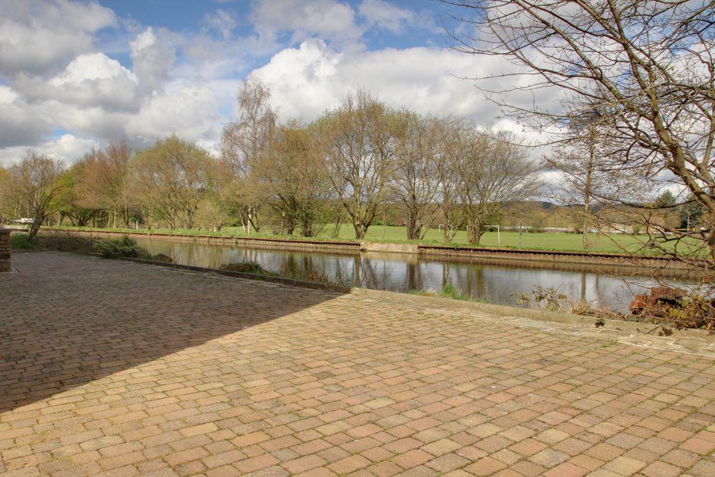 Seating area, canal and field views