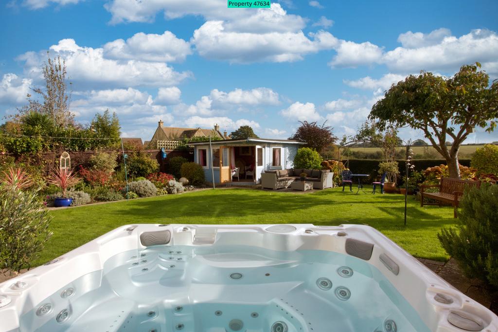 Hot tub looking out onto summer house