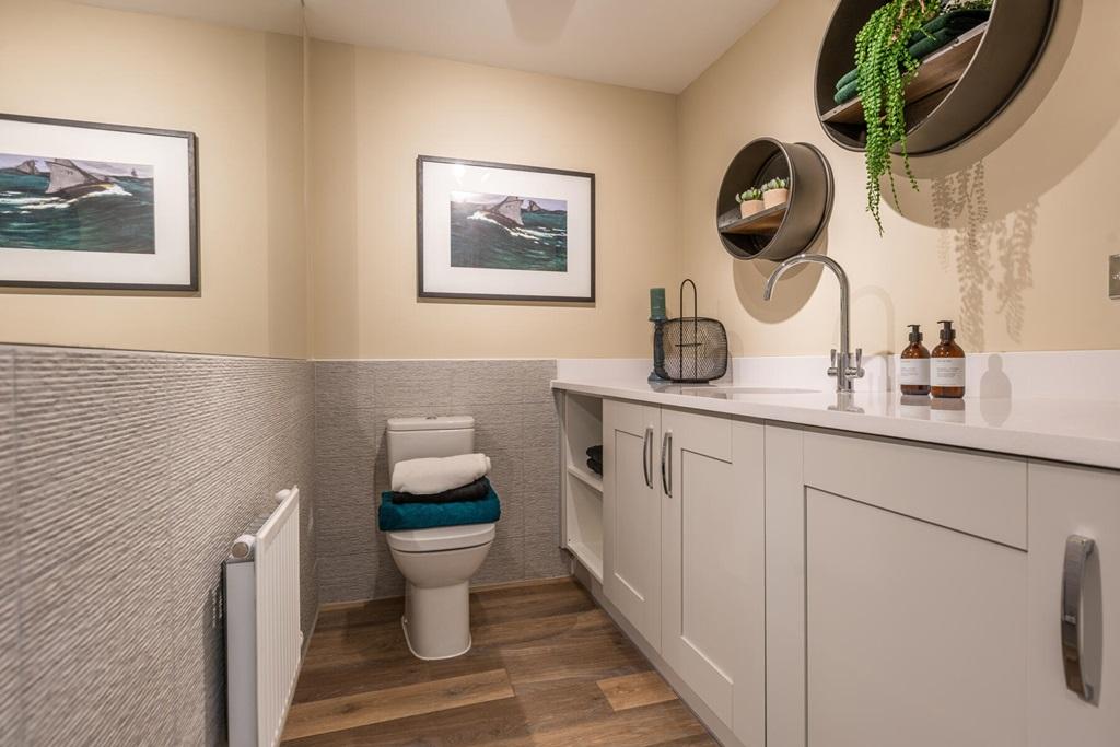 Handy cloakroom and utility room with laundry space