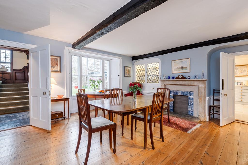 Dining room with rear hall stairs beyond