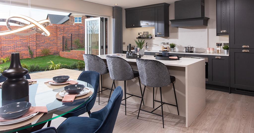Kitchen/dining area with bi-fold doors and...