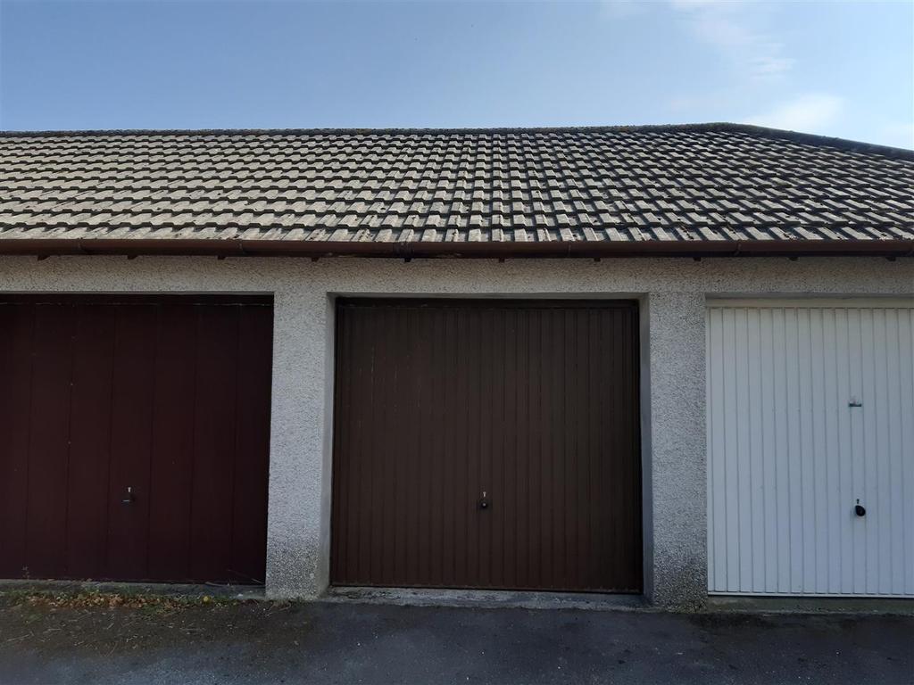 Single garage in nearby block