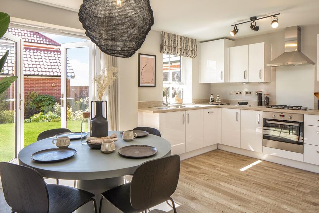Inside view of the open plan kitchen with French doors opening onto the garden. Maidstone. 3 bed hom