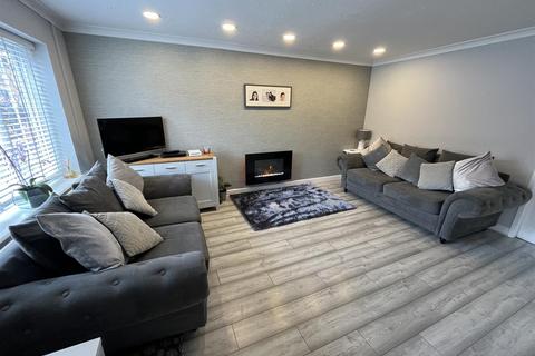 57 Turnberry Drive, Wilmslow, SK9 2QW