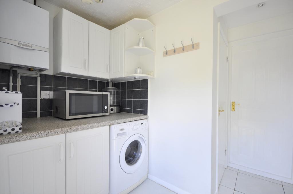 Utility room with access to garage