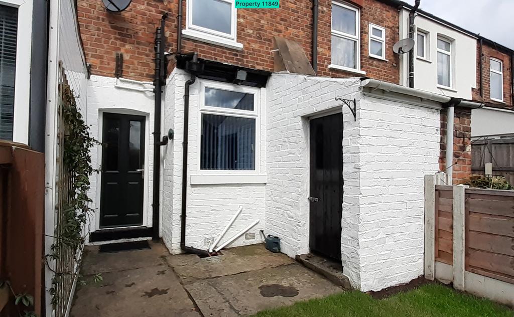 Rear of house, includes attached brick shed