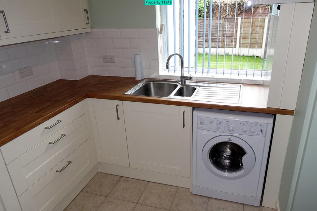 Kitchen has outlook onto back garden
