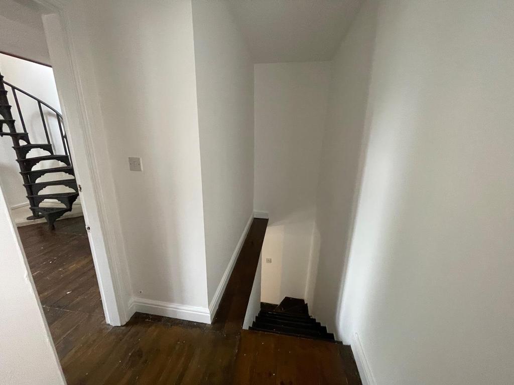 Stairs rise to the first floor