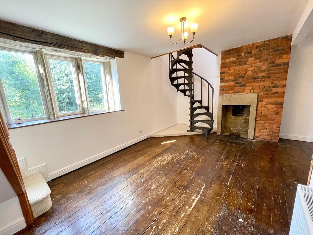 Lounge room with featured spiral staircase