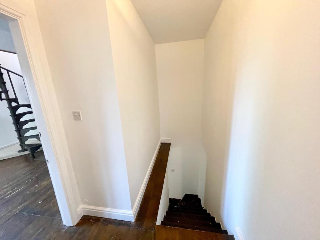 Stairs rise to the first floor
