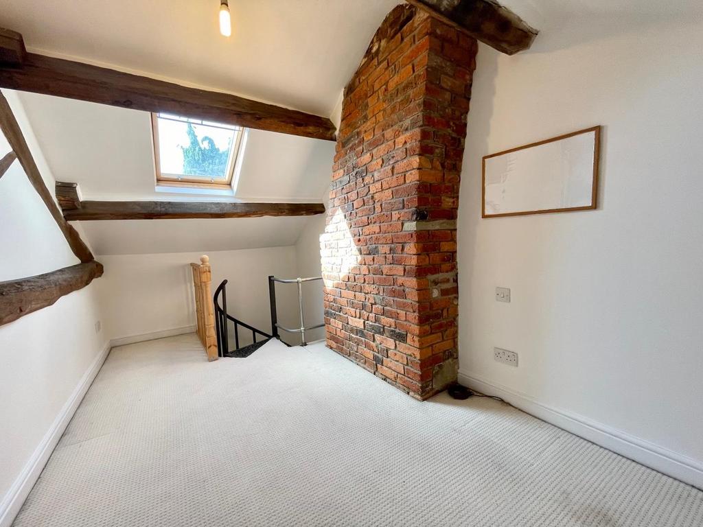 Stairs rise to the first floor