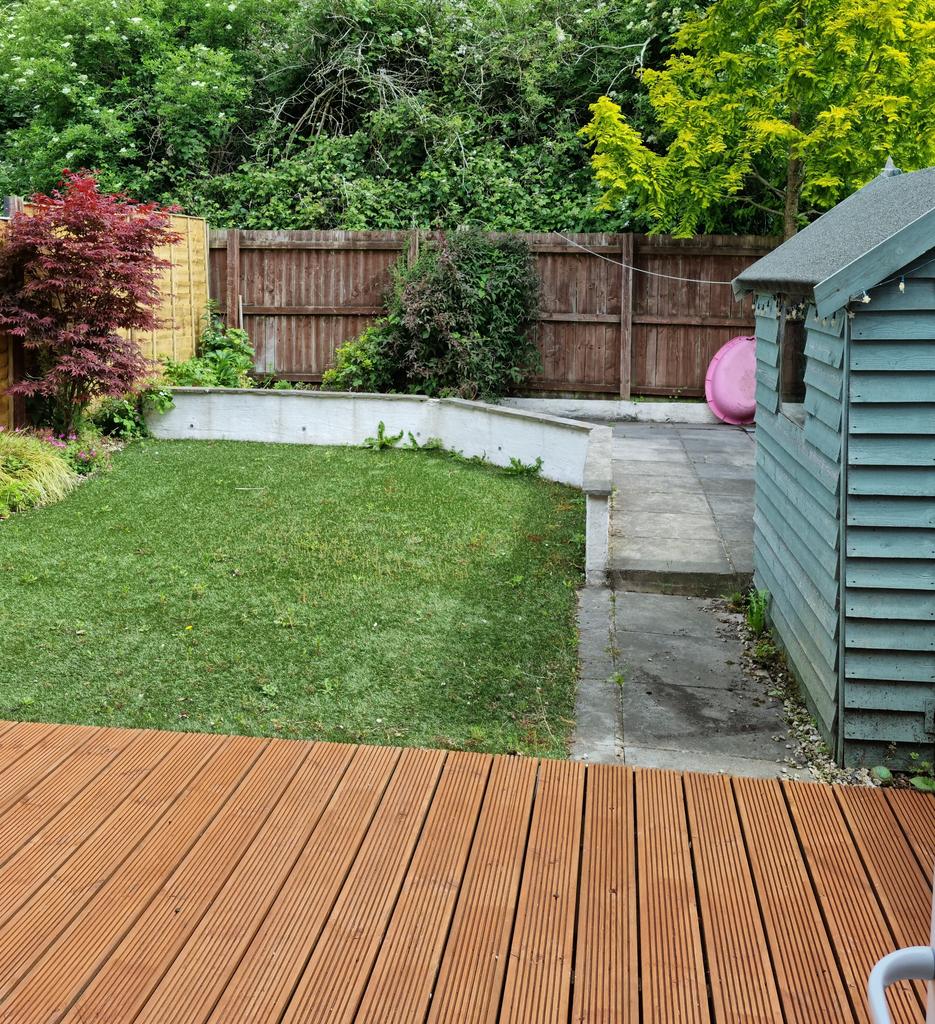 Back garden with decking and patio areas, fake...