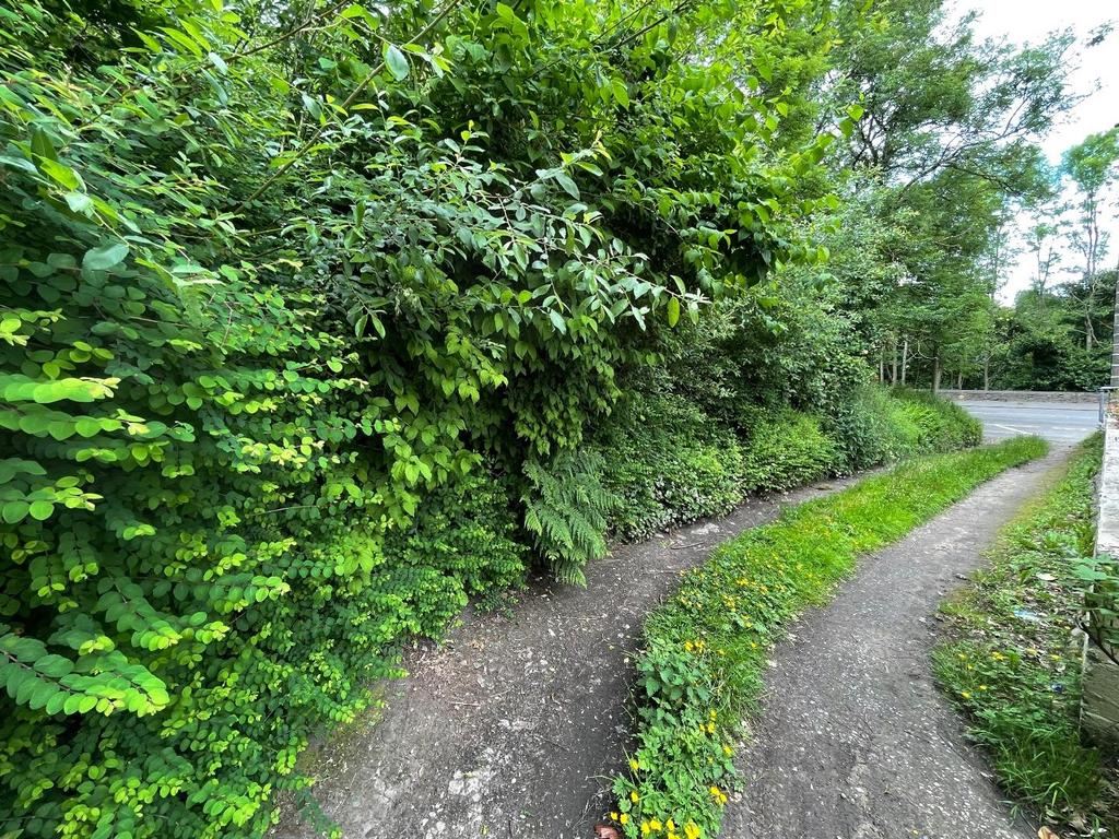 Off road parking to rear via leased land