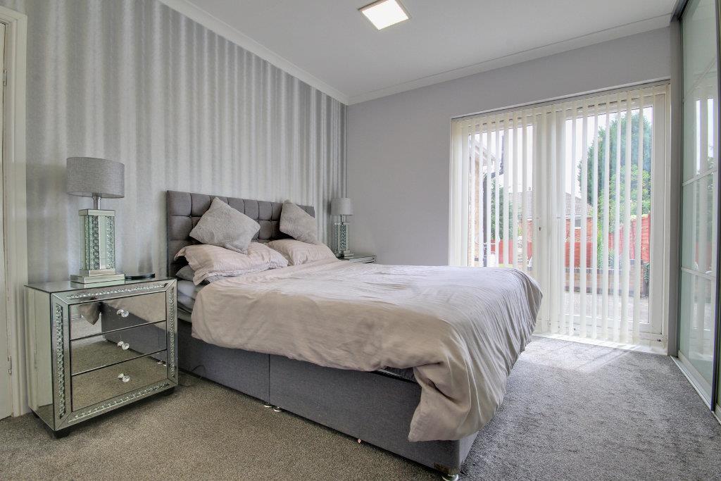 Bedroom One with french doors.jpg