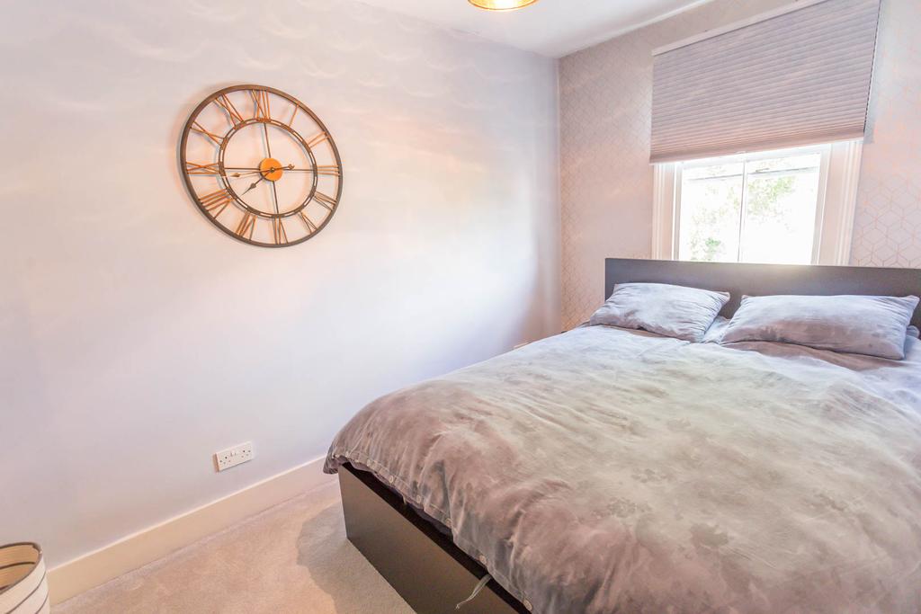Bedroom 3 with wardrobe and fireplace