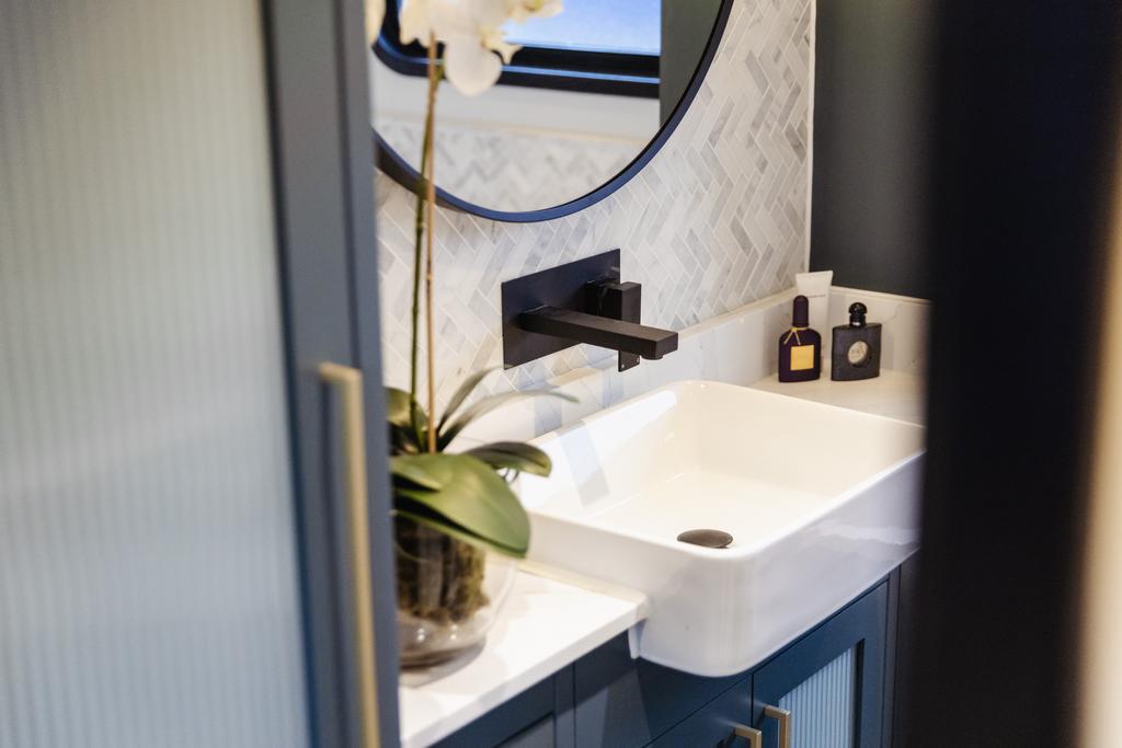 Granite vanity unit and plenty of bathroom storage