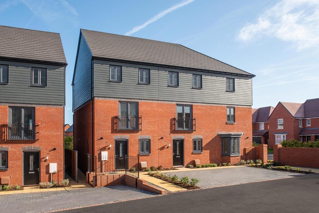 External view of a courtyard featuring three bedroom townhouses