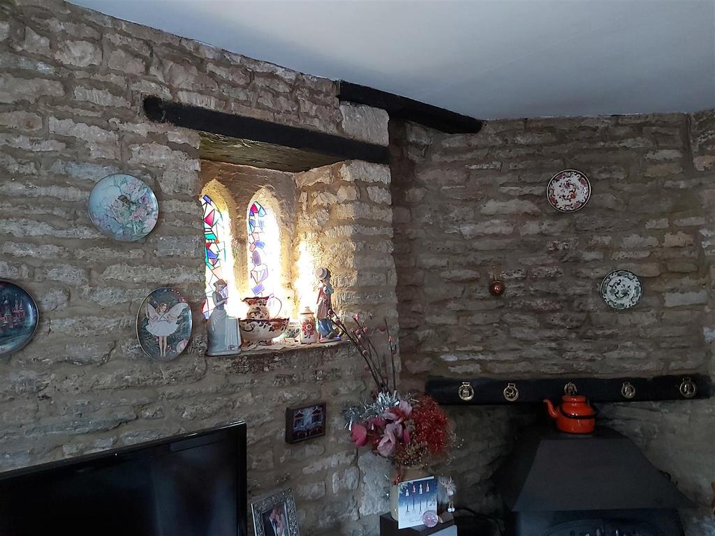 Lounge stained glass window and fireplace.jpg