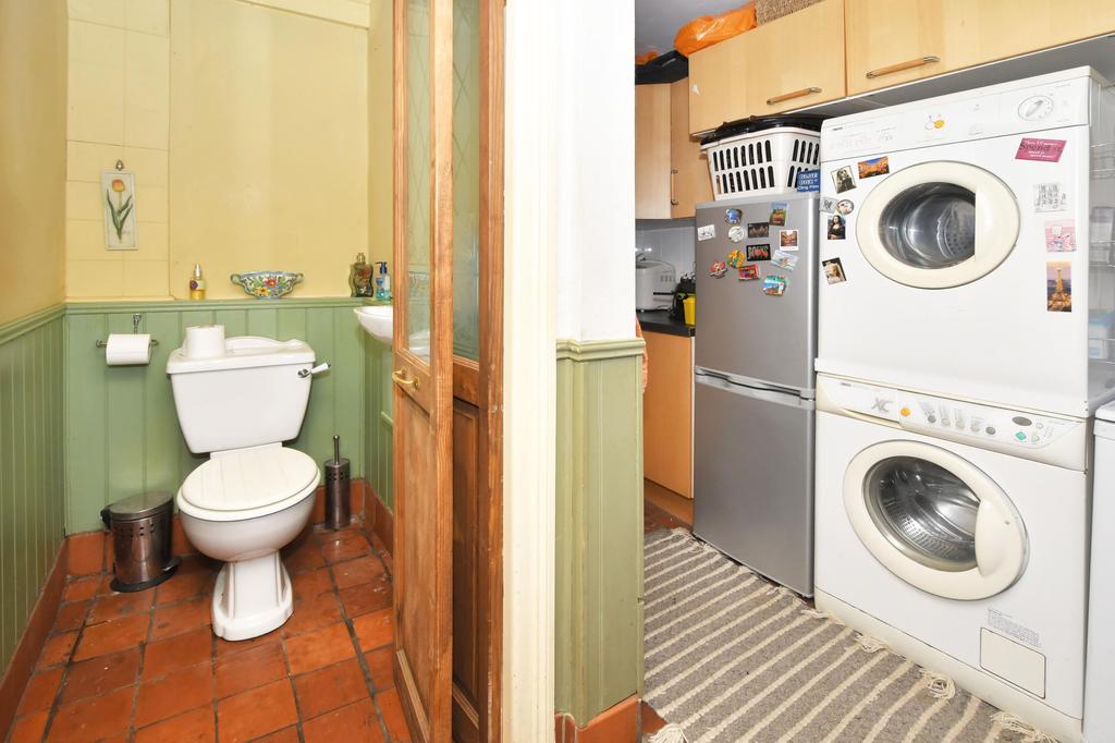 Guest cloak room, rear hallway and utility room