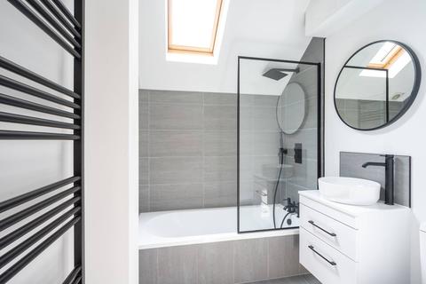 1a Gilbert Road, London, SW19 1BP