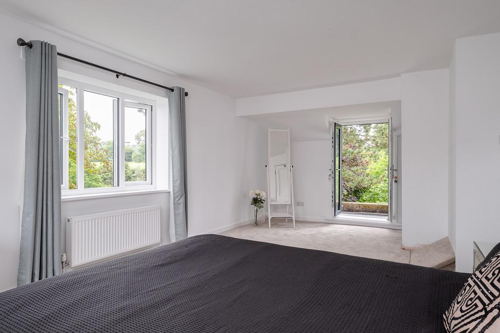 Double bedroom with French doors to balcony