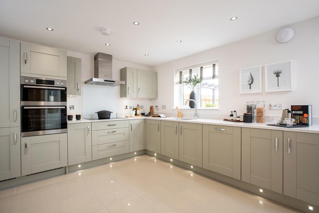 A modern, easy to clean kitchen with ample...