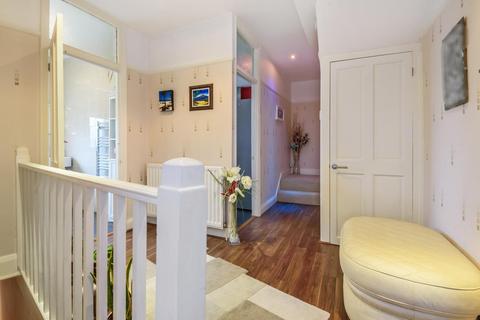 244a Grand Drive, Raynes Park, London, SW20 9NE