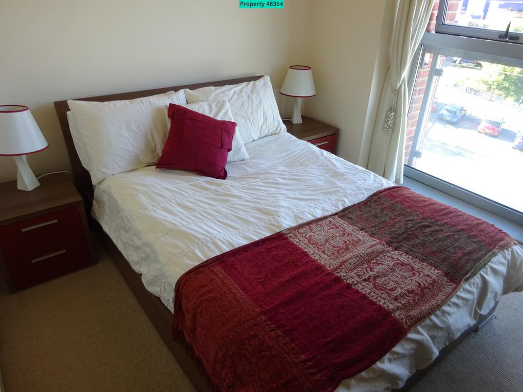 Double bed with bedside cabinets