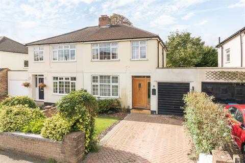 55 Balmoral Crescent, West Molesey, KT8 1QA