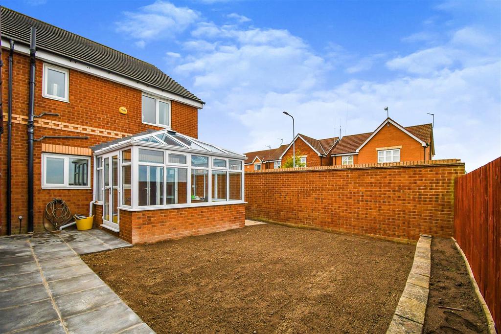 To the rear of the house