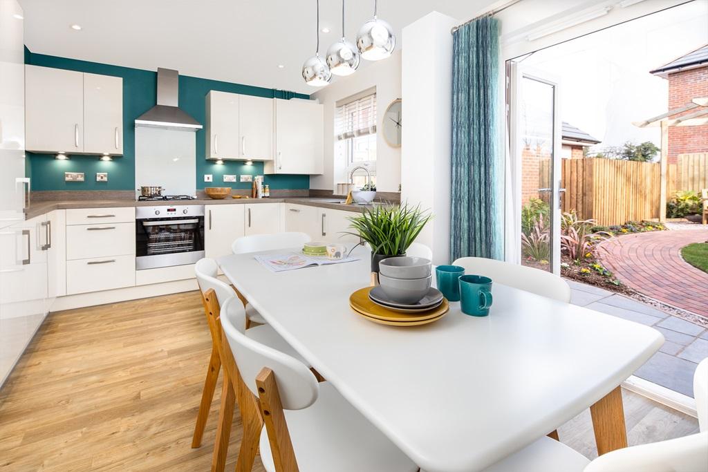 Open plan kitchen with French doors to the...