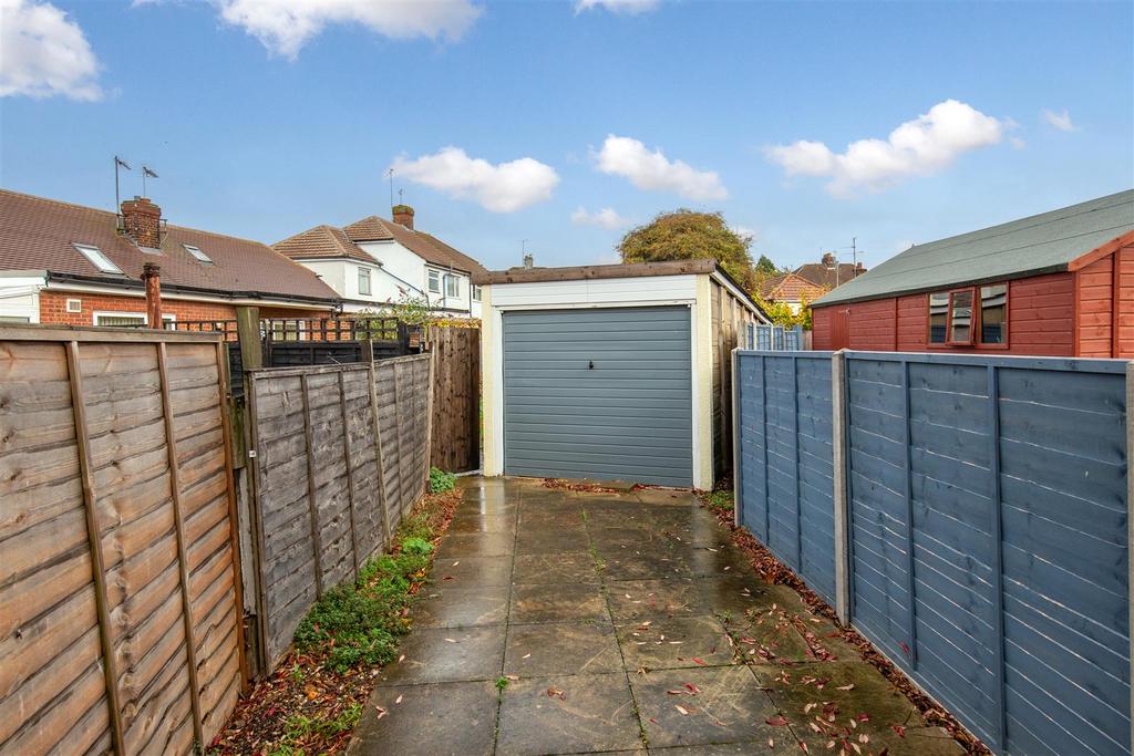 Garage And Driveway To The Rear