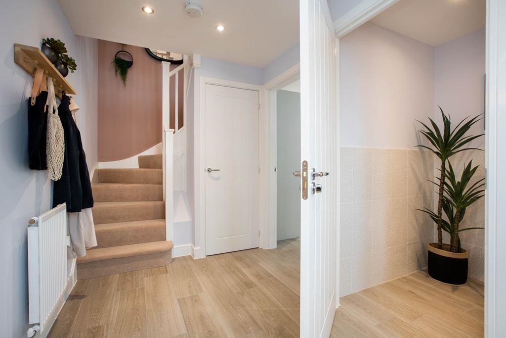 Hallway with cloakroom and storage cupboard