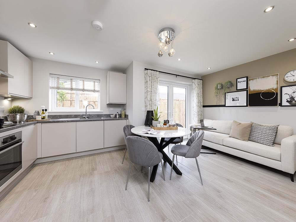 Kitchen/dining/family area with French doors to...