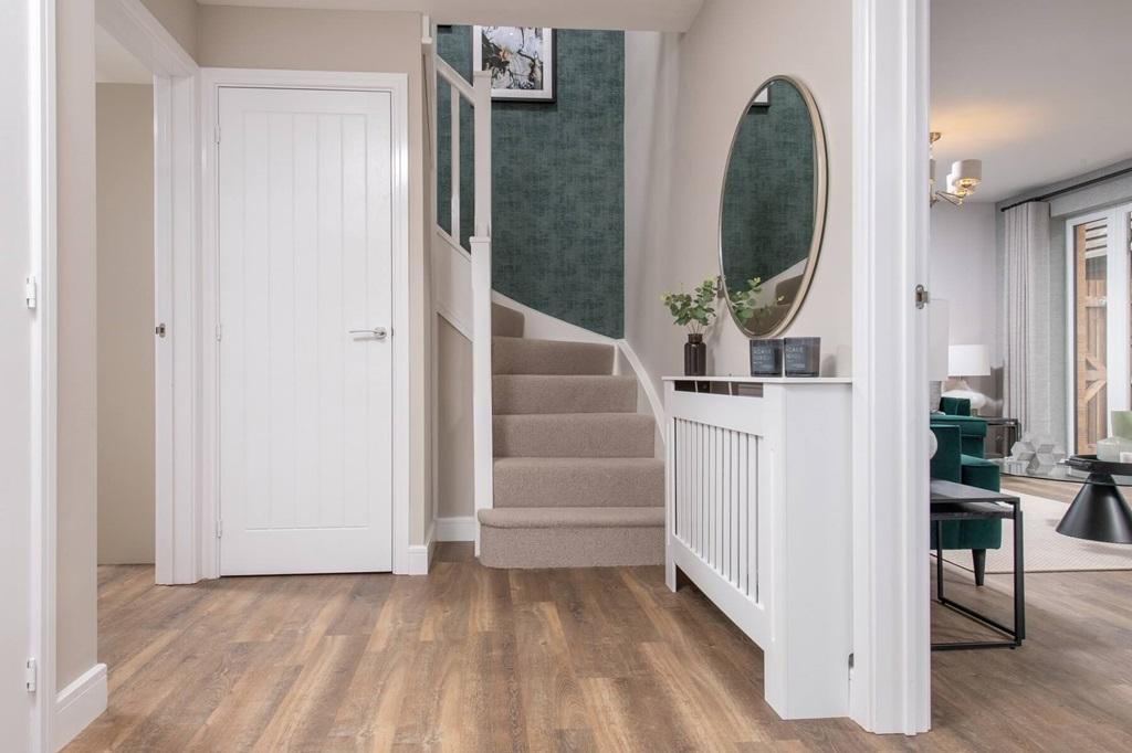 The welcoming entrance hallway is a light and airy space