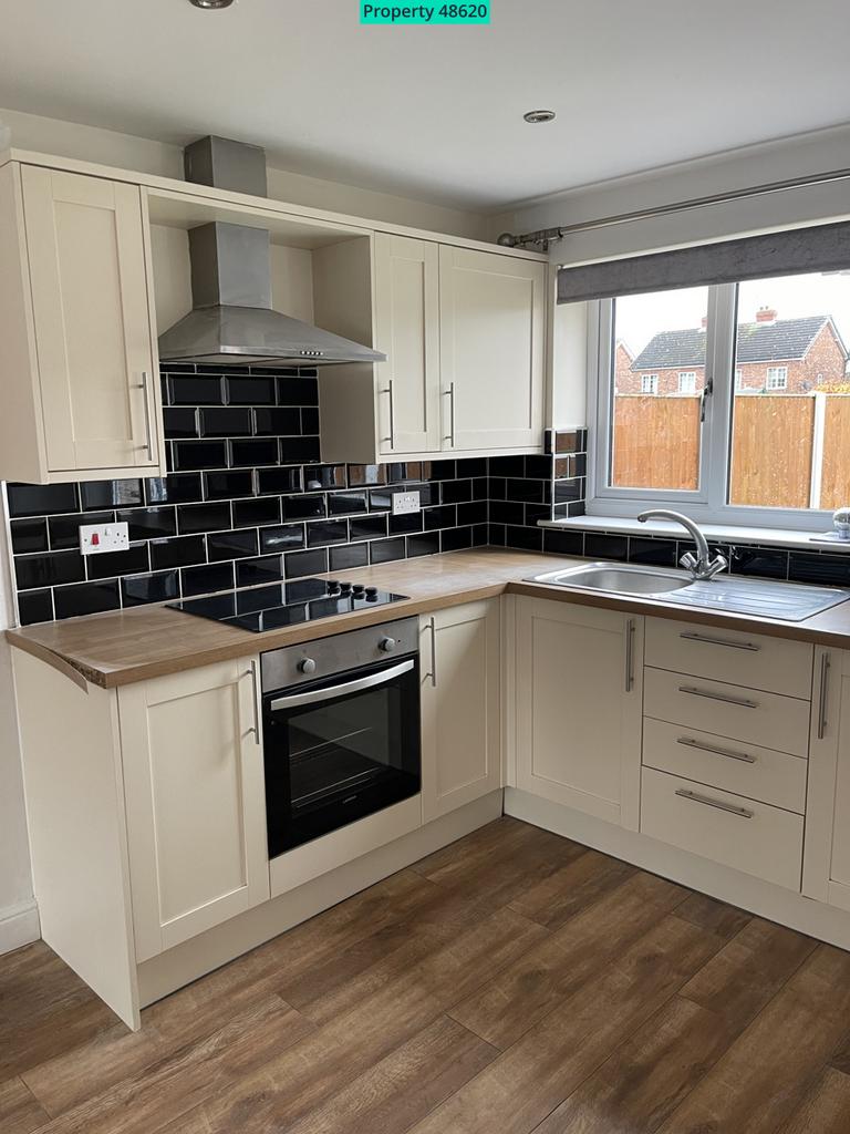 Fully fitted and tiled kitchen