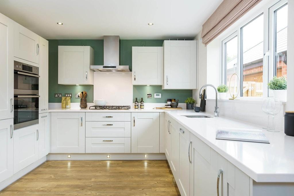 The bright and airy kitchen is the perfect...