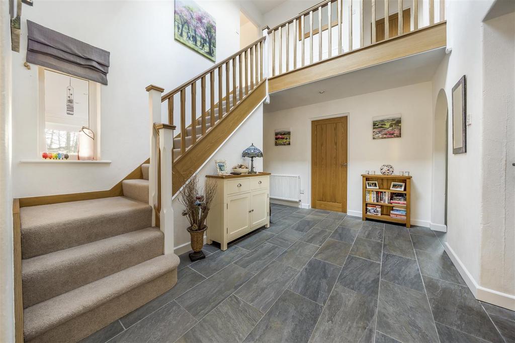 Large Hall way with wooden staircase