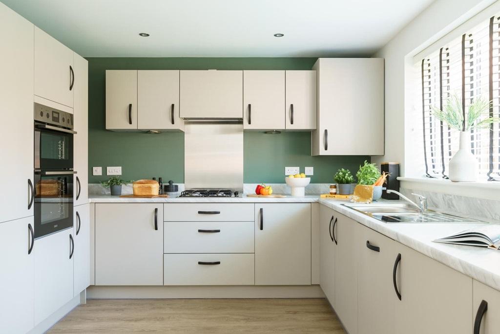 The modern kitchen has ample storage cupboards