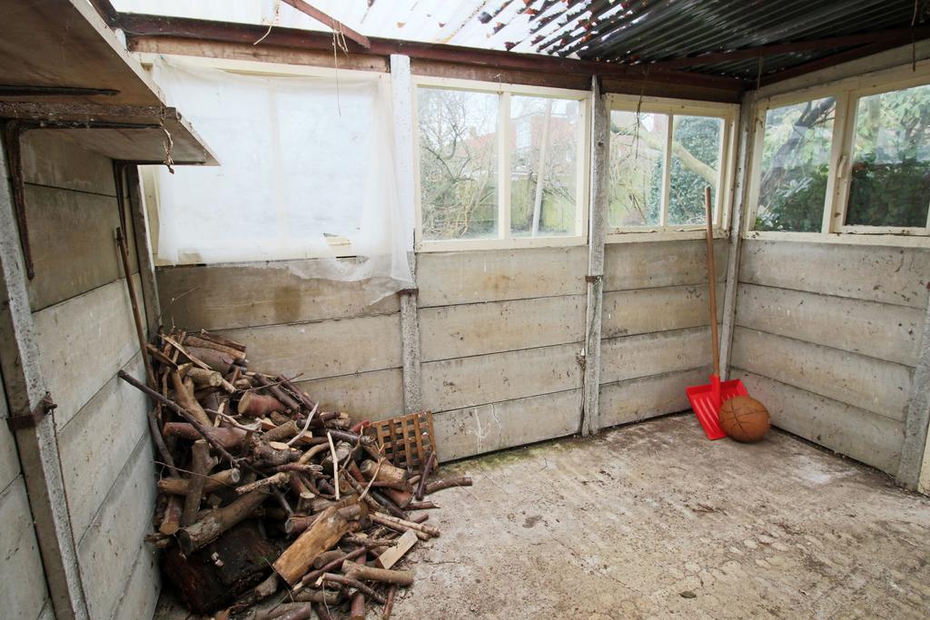 Greenhouse wood store