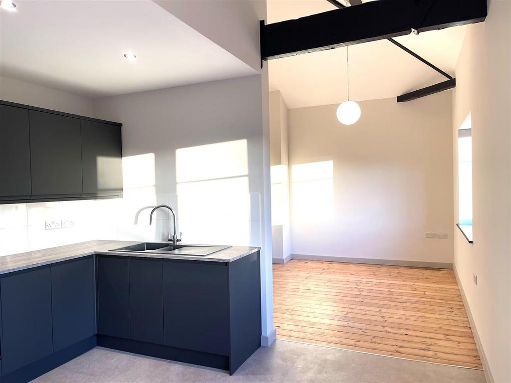 KITCHEN OPENING TO LIVING ROOM.jpg