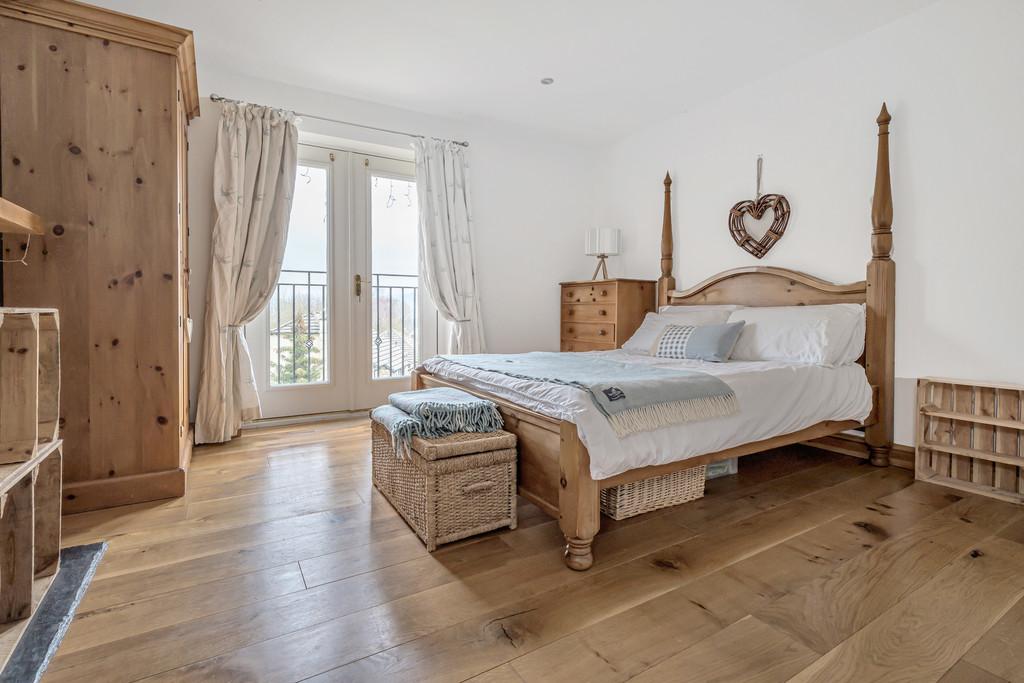 Bedroom 1 with balcony rail