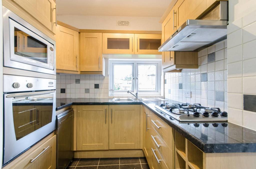 Double oven in modern sizeable fitted kitchen
