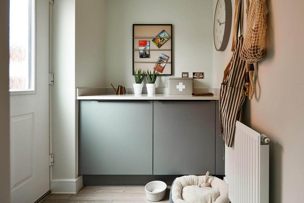 An adjoining utility area offers space for...